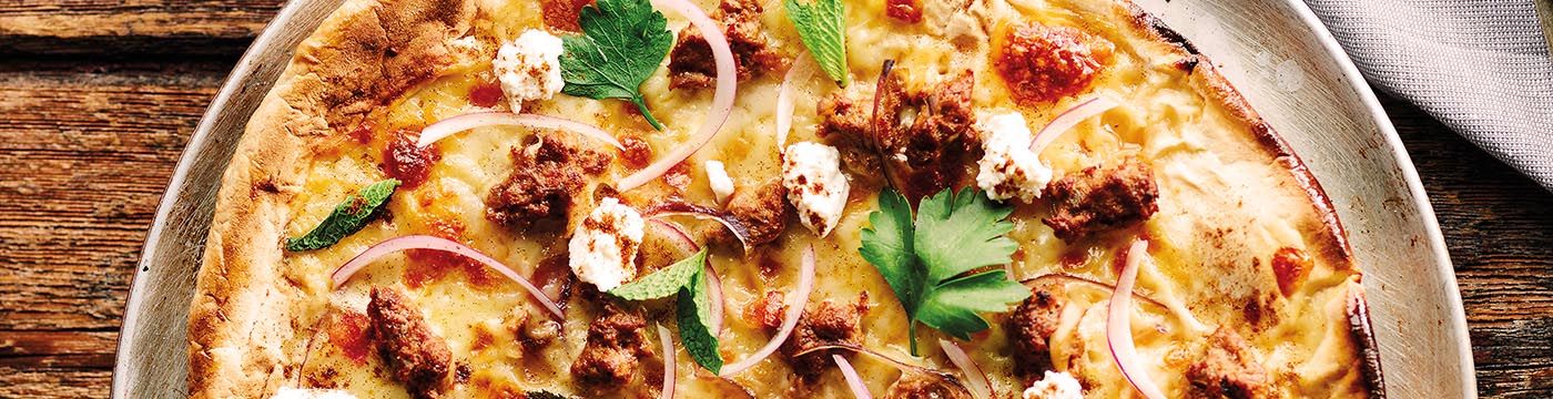 Lamb Laham Bajine Pizza served on a plate