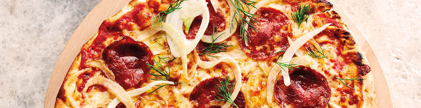 Salami and Fennel Pizza served on wooden board