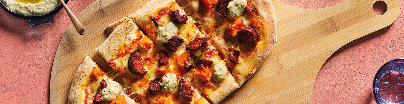 Sweet Potato & Chorizo Pizza served on wooden board